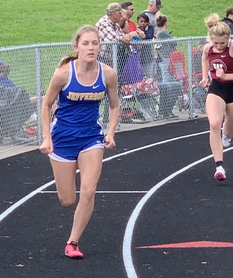 Jefferson’s Ellie Hintz emerges from the 400-meter blocks in the MITCA state team final on Friday.