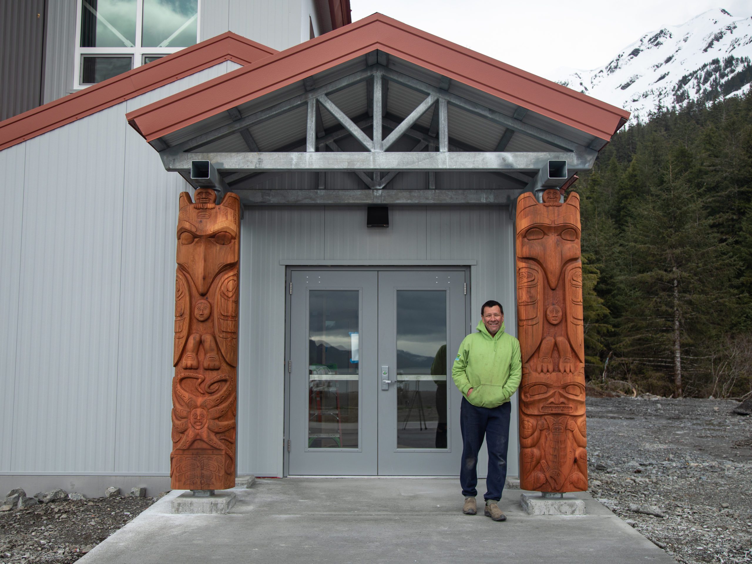 Which means behind the totem that surrounds the entrance to the new science center
